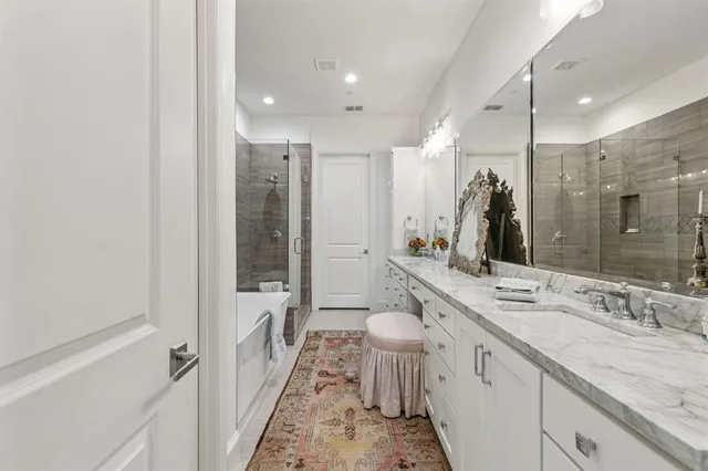 a bathroom with a granite countertop sink a toilet and a mirror