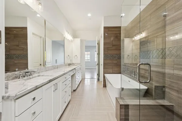 a bathroom with a double vanity sink and mirror