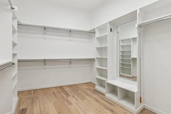 a view of an empty walk in closet