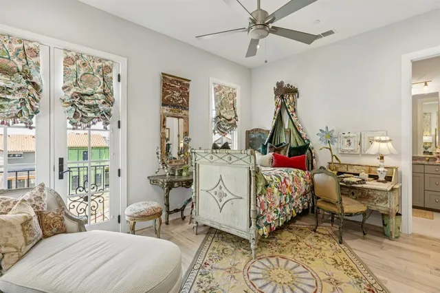 a bathroom with a granite countertop sink a toilet and a mirror