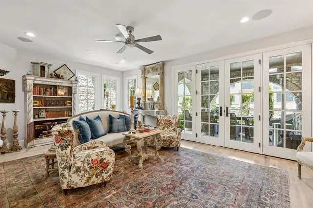 a bathroom with a granite countertop sink a toilet and a mirror