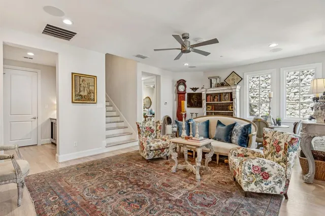 a living room with furniture window and wooden floor