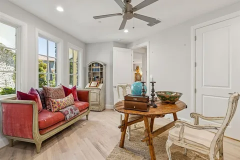 a view of a livingroom with furniture and a window