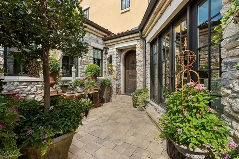 a front view of a house with garden