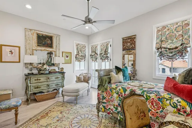 a bedroom with a bed and ceiling fan