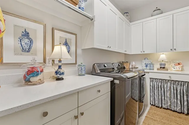 a view of a hallway with wooden floor and stairs