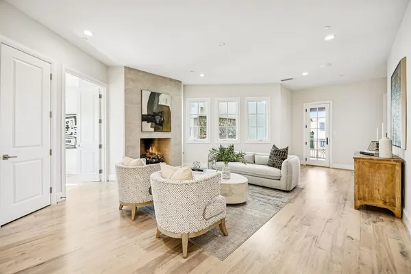 a living room with furniture or wooden floor and a chandelier