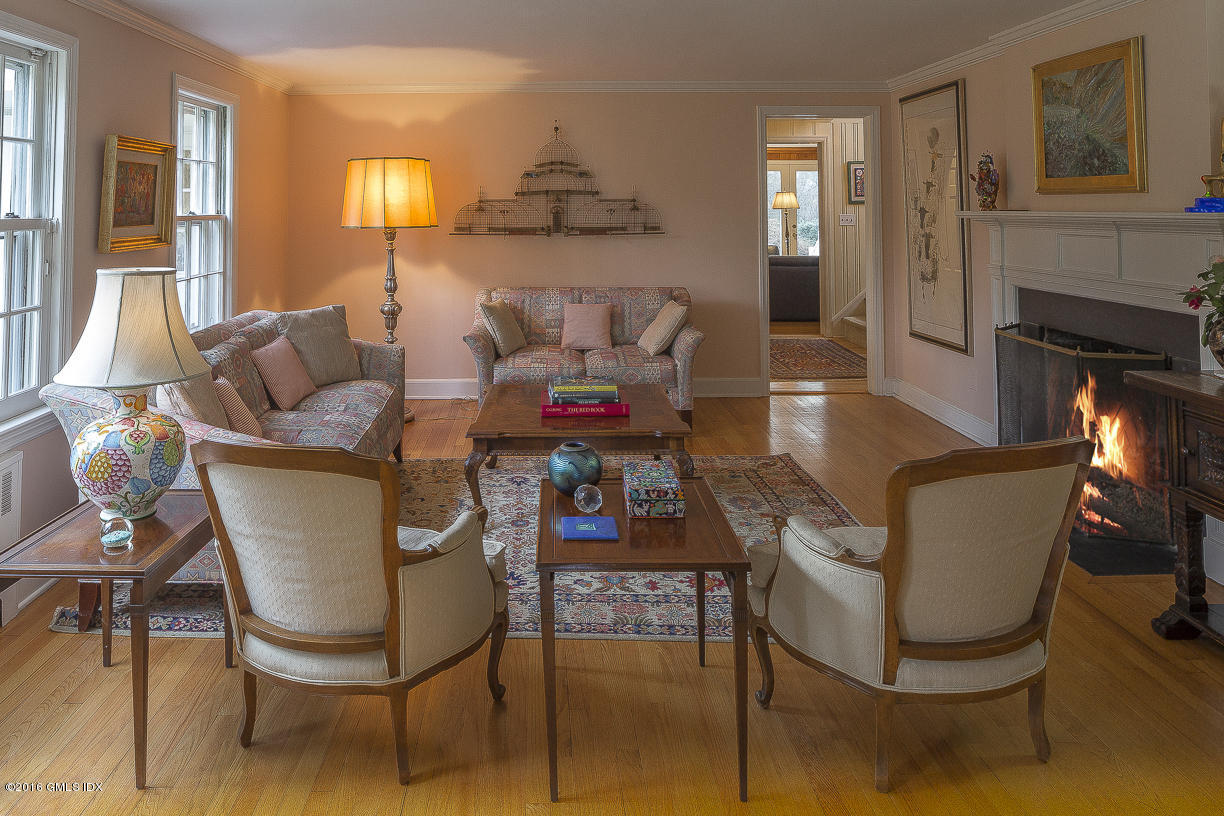 2 Boxwood Lane Greenwich, CT 06830 - Photo 11 of 23 a living room with furniture a fireplace and a flat screen tv