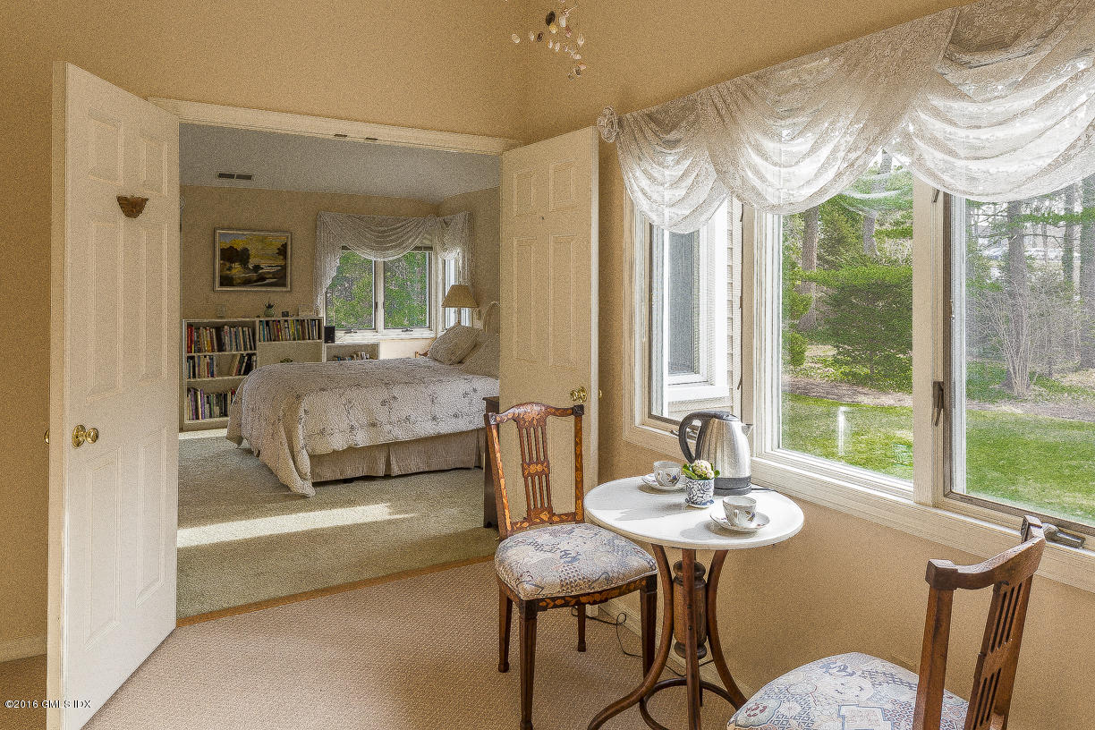 2 Boxwood Lane Greenwich, CT 06830 - Photo 15 of 23 a spacious bedroom with a bed and a table