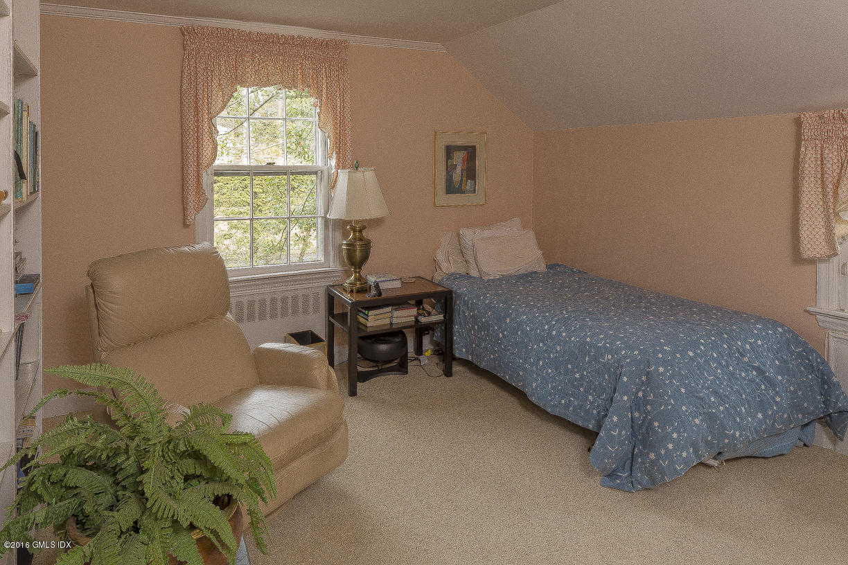 2 Boxwood Lane Greenwich, CT 06830 - Photo 18 of 23 a bedroom with a bed and a couch