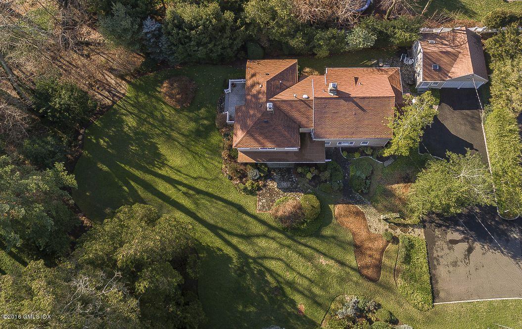 2 Boxwood Lane Greenwich, CT 06830 - Photo 20 of 23 an aerial view of a house with a garden and lake view