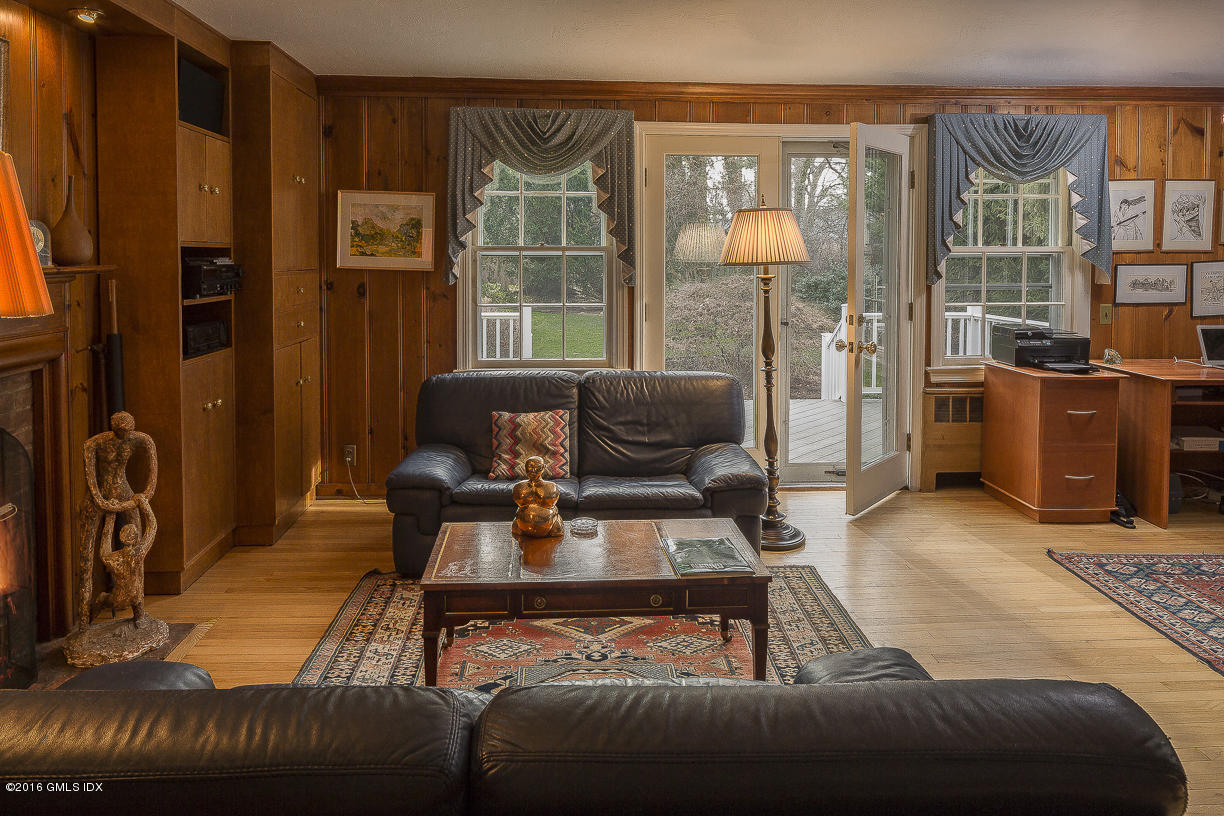 2 Boxwood Lane Greenwich, CT 06830 - Photo 8 of 23 a living room with furniture and a floor to ceiling window