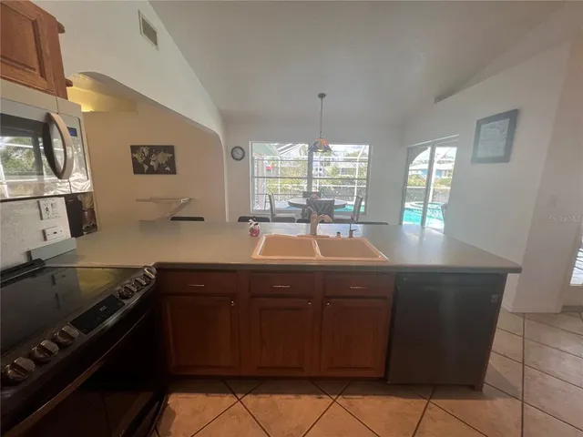 a kitchen with a sink and cabinets