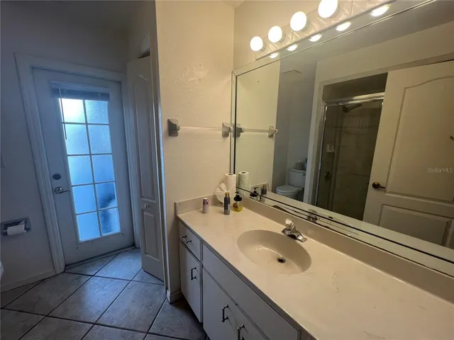 a bathroom with a sink double vanity and a mirror