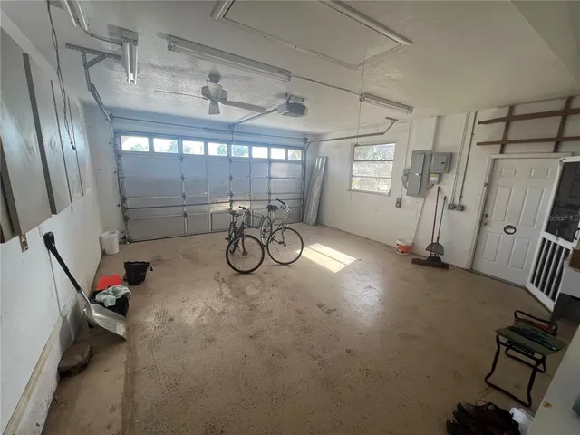 a backyard of a house with a yard and outdoor seating