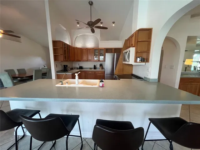 a view of a dining room with furniture and a chandelier