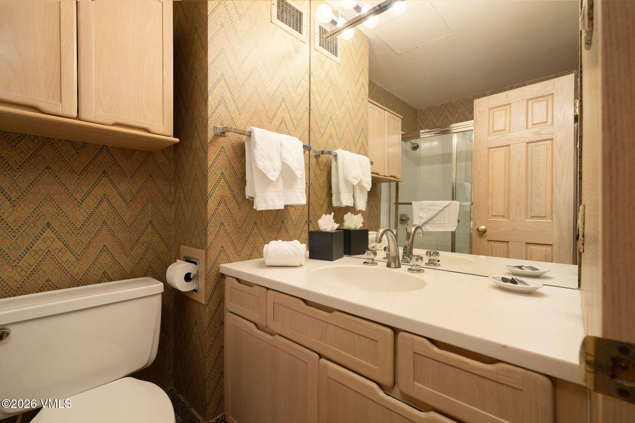 200 Vail Road, Unit 799 Vail, CO 81657 - Photo 14 of 32 a bathroom with a sink toilet and mirror