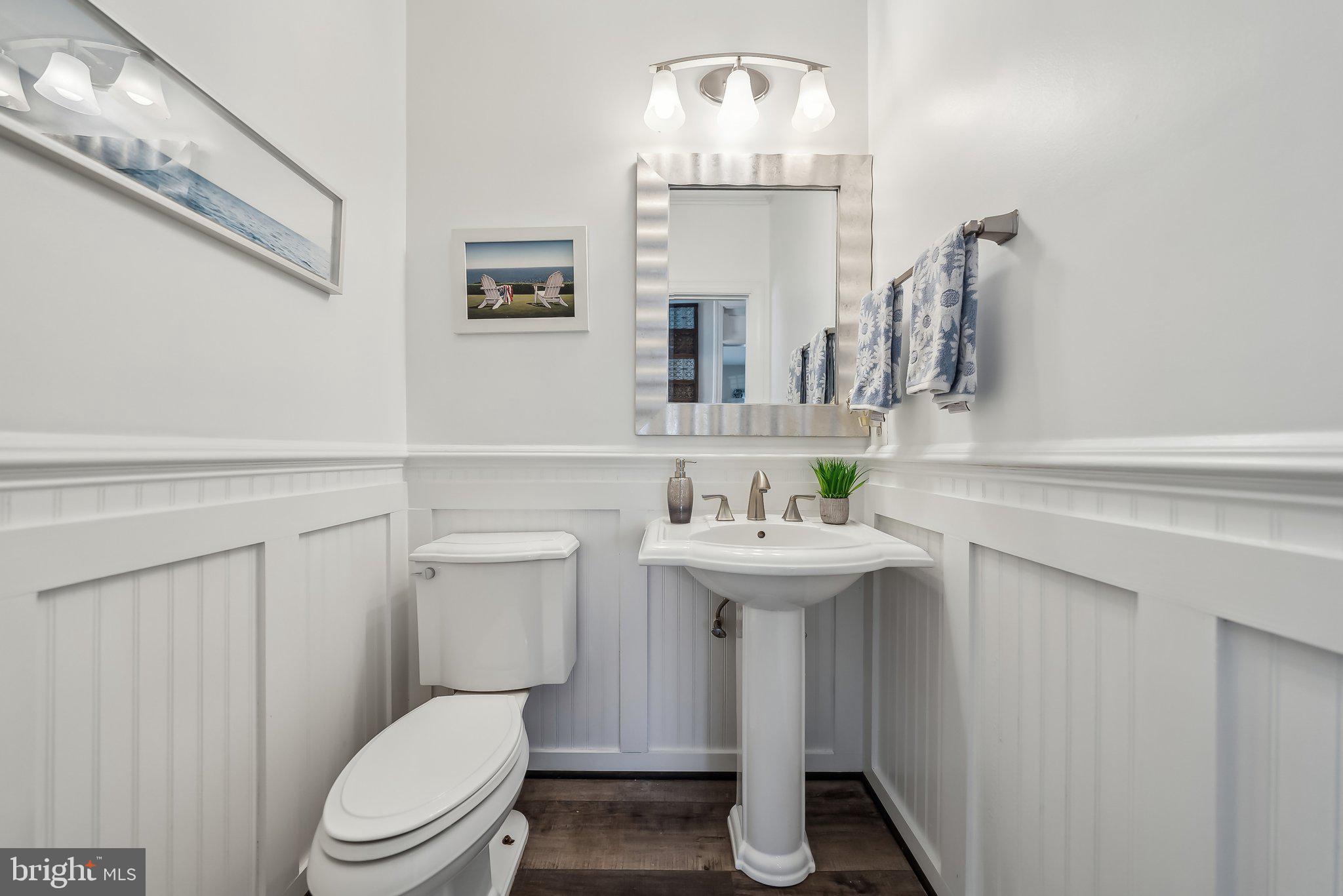 9061 Roaring Spring Loop Bristow, VA 20136 - Photo 19 of 55 a bathroom with a sink a toilet and a mirror