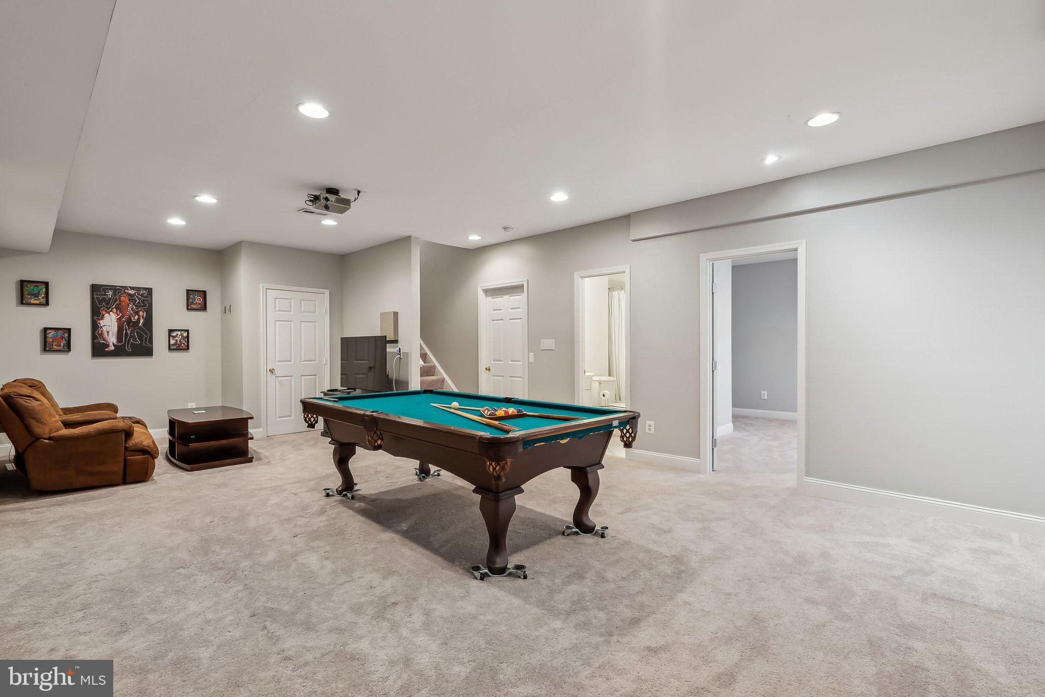 9061 Roaring Spring Loop Bristow, VA 20136 - Photo 23 of 55 a room with furniture pool table and couches