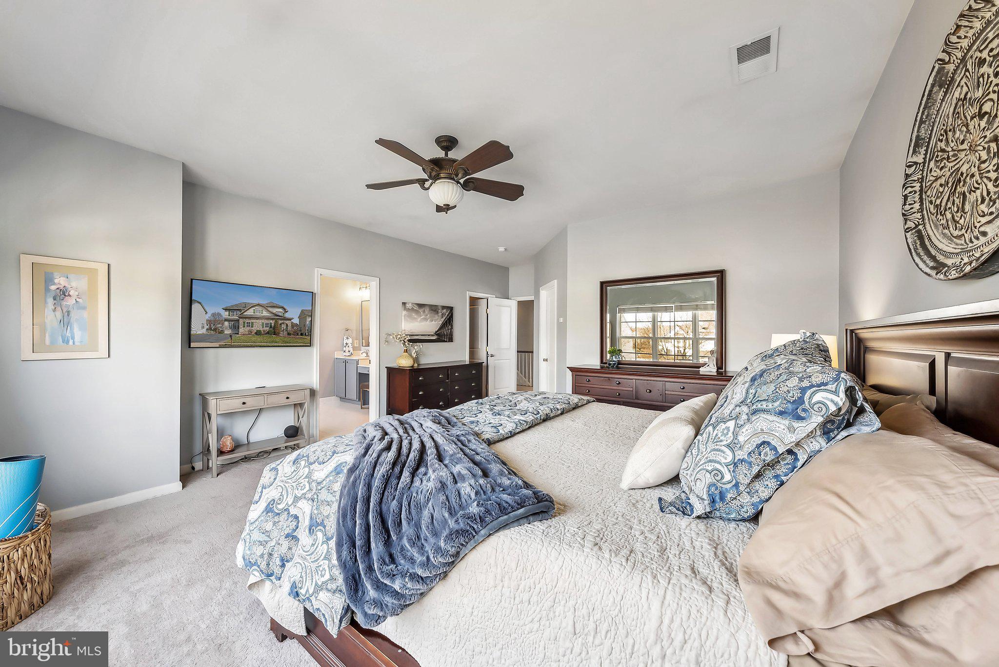 9061 Roaring Spring Loop Bristow, VA 20136 - Photo 33 of 55 a bed sitting in a bedroom and window