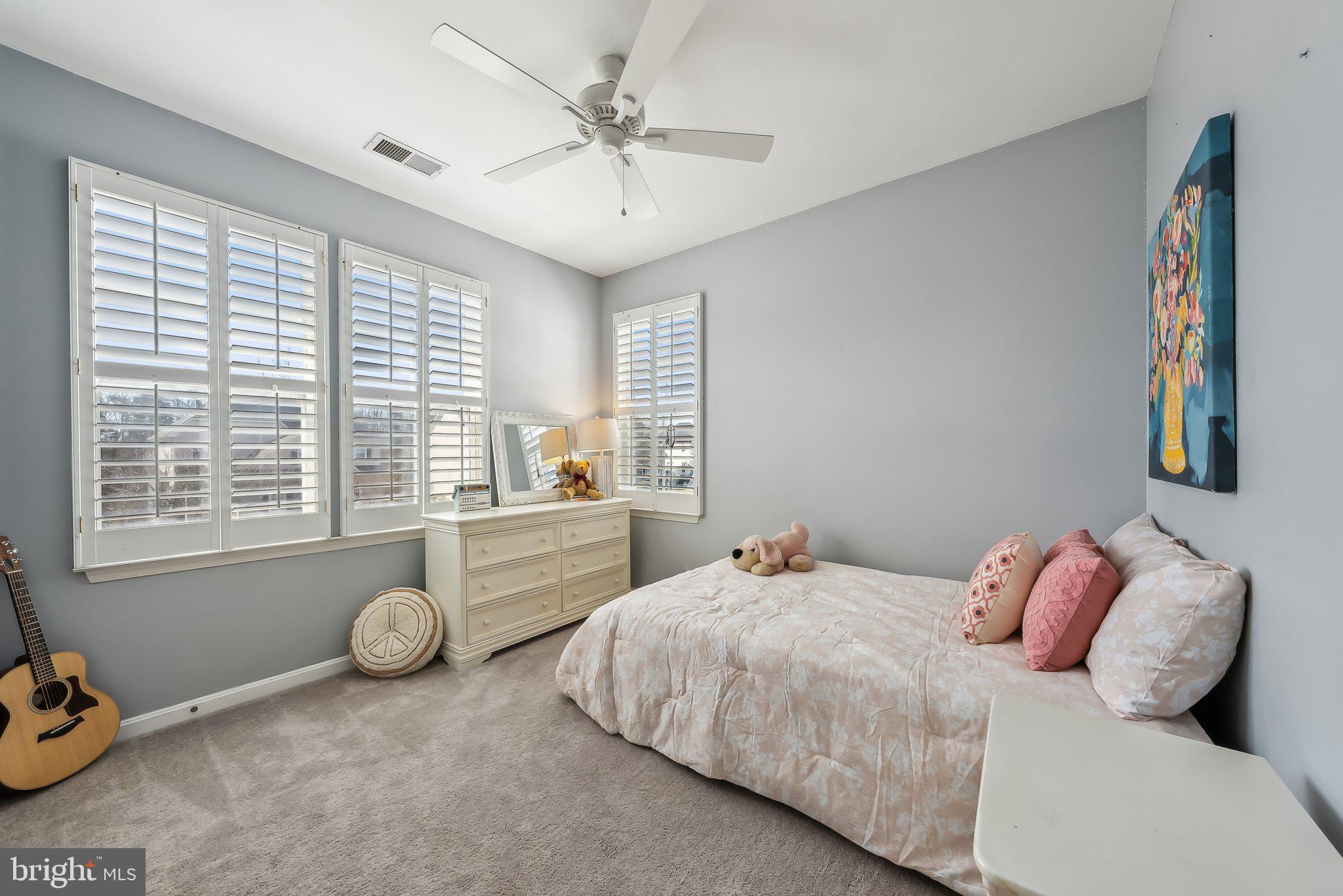 9061 Roaring Spring Loop Bristow, VA 20136 - Photo 39 of 55 a bedroom with a bed and a window