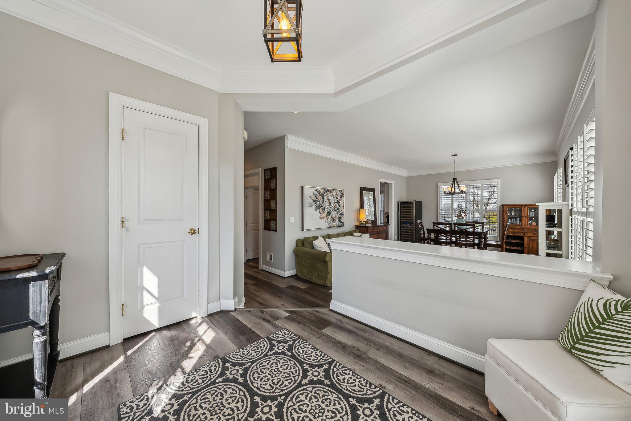 9061 Roaring Spring Loop Bristow, VA 20136 - Photo 4 of 55 a living room with furniture and a wooden floor