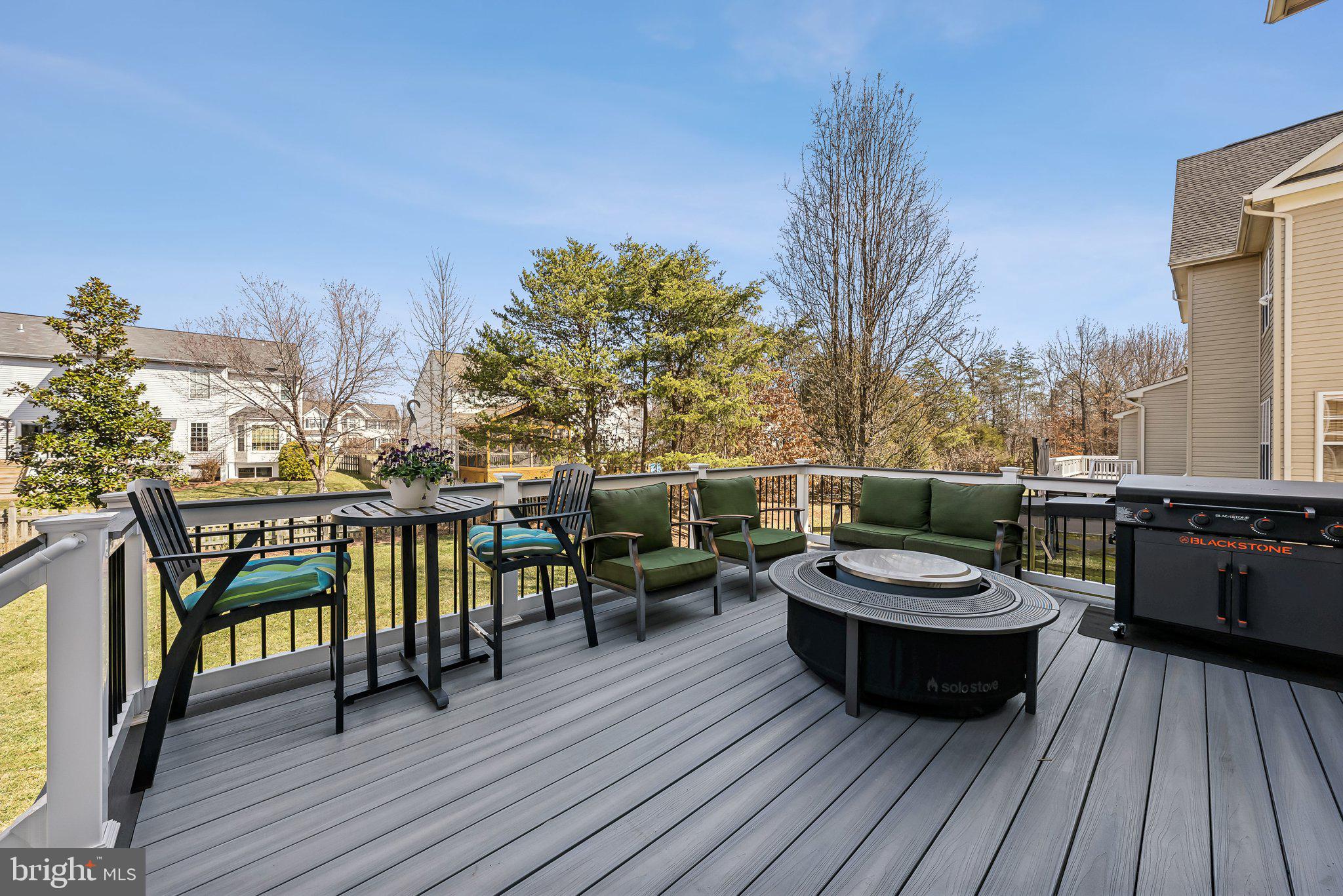 9061 Roaring Spring Loop Bristow, VA 20136 - Photo 46 of 55 a view of a balcony with chairs and wooden floor