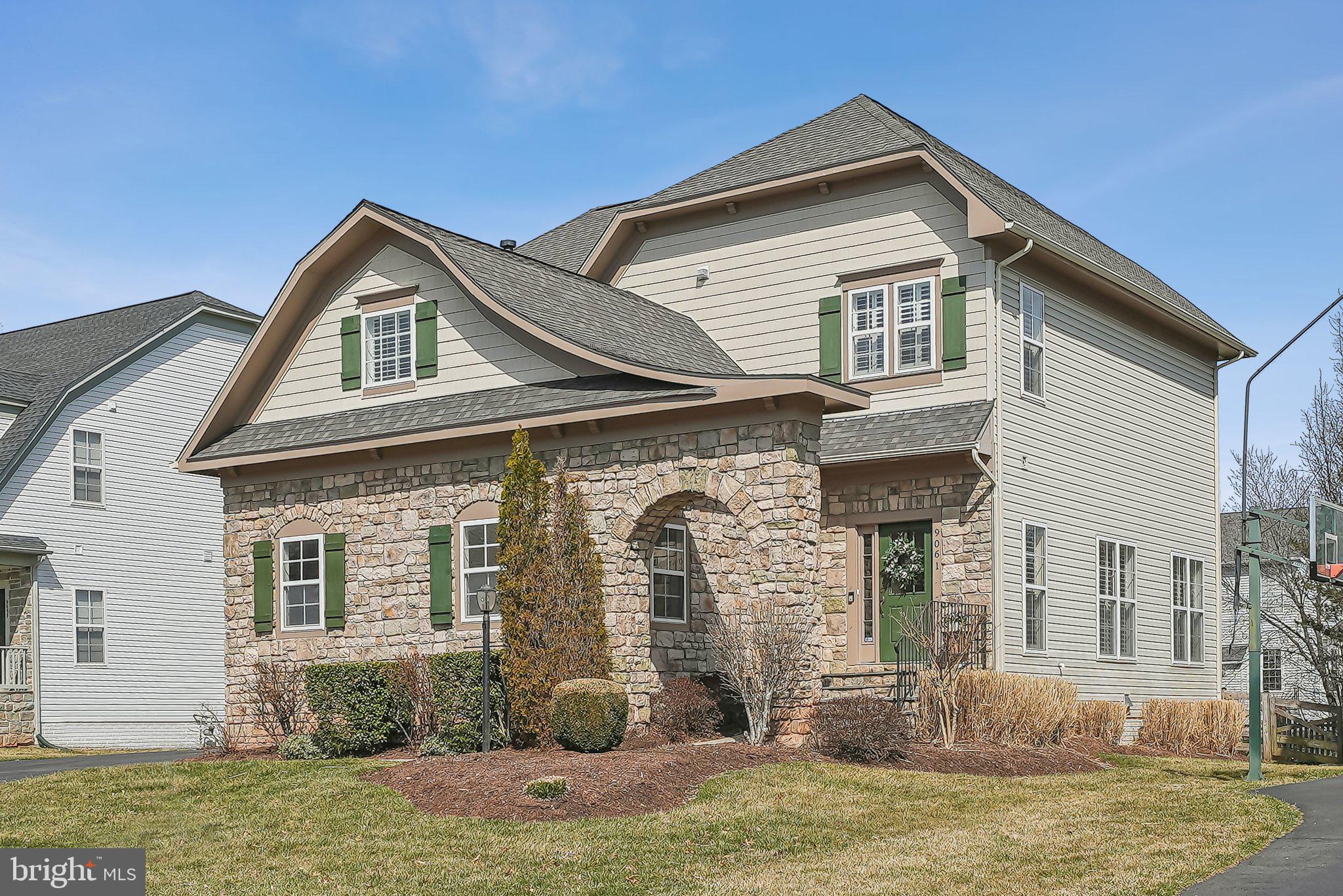 9061 Roaring Spring Loop Bristow, VA 20136 - Photo 51 of 55 a front view of a house with a yard