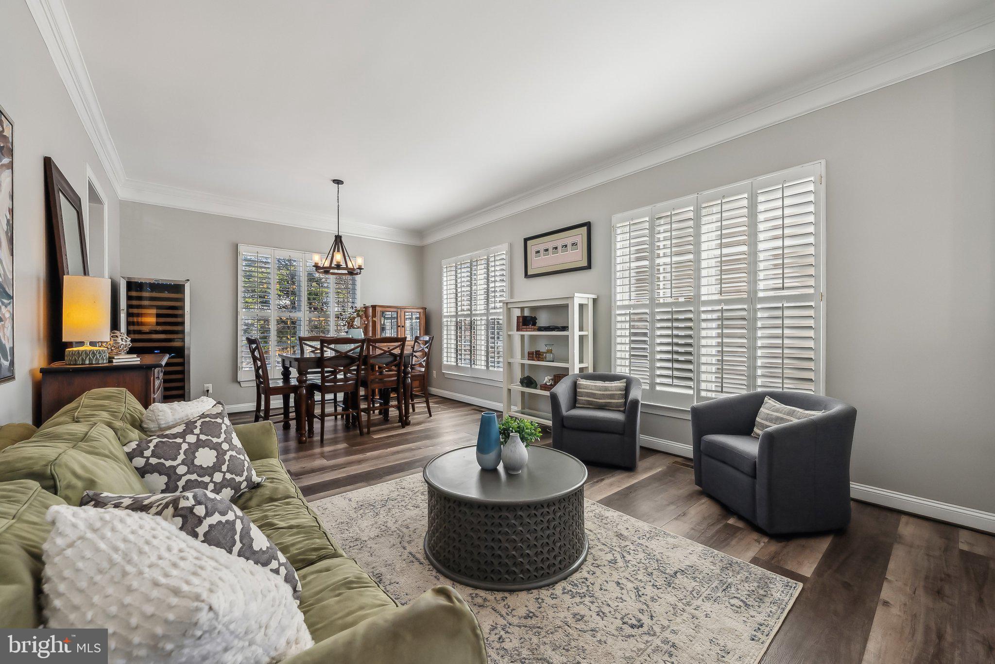 9061 Roaring Spring Loop Bristow, VA 20136 - Photo 6 of 55 a living room with furniture and a large window