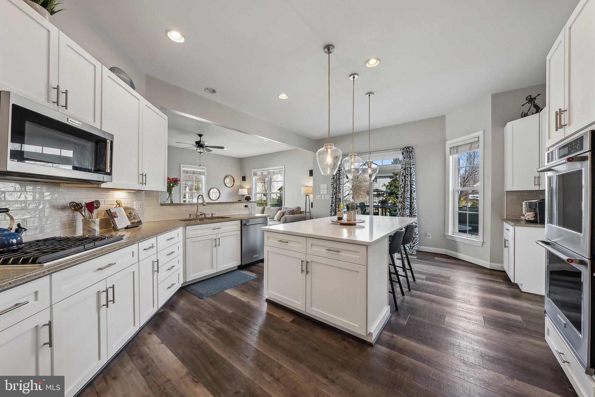 9061 Roaring Spring Loop Bristow, VA 20136 - Photo 10 of 55 a kitchen with stove a sink and refrigerator