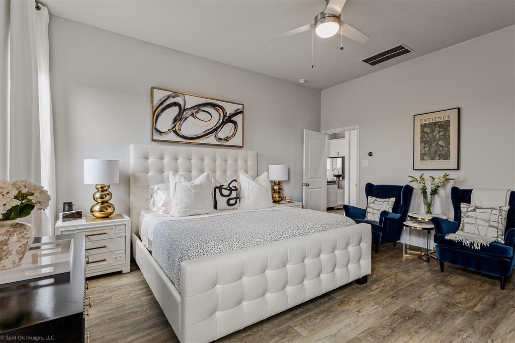 6513 Earley Way Forney, TX 75126 - Photo 15 of 36 a bedroom with a bed and wooden floor