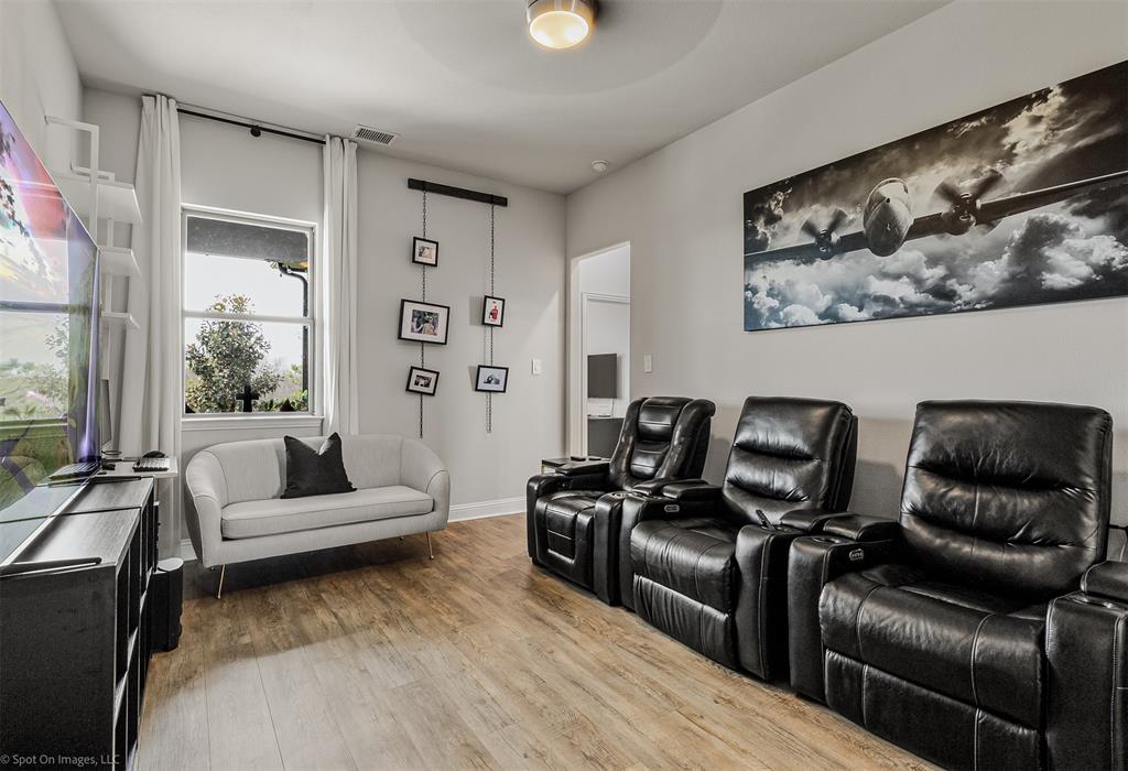 6513 Earley Way Forney, TX 75126 - Photo 21 of 36 a living room with furniture and a flat screen tv