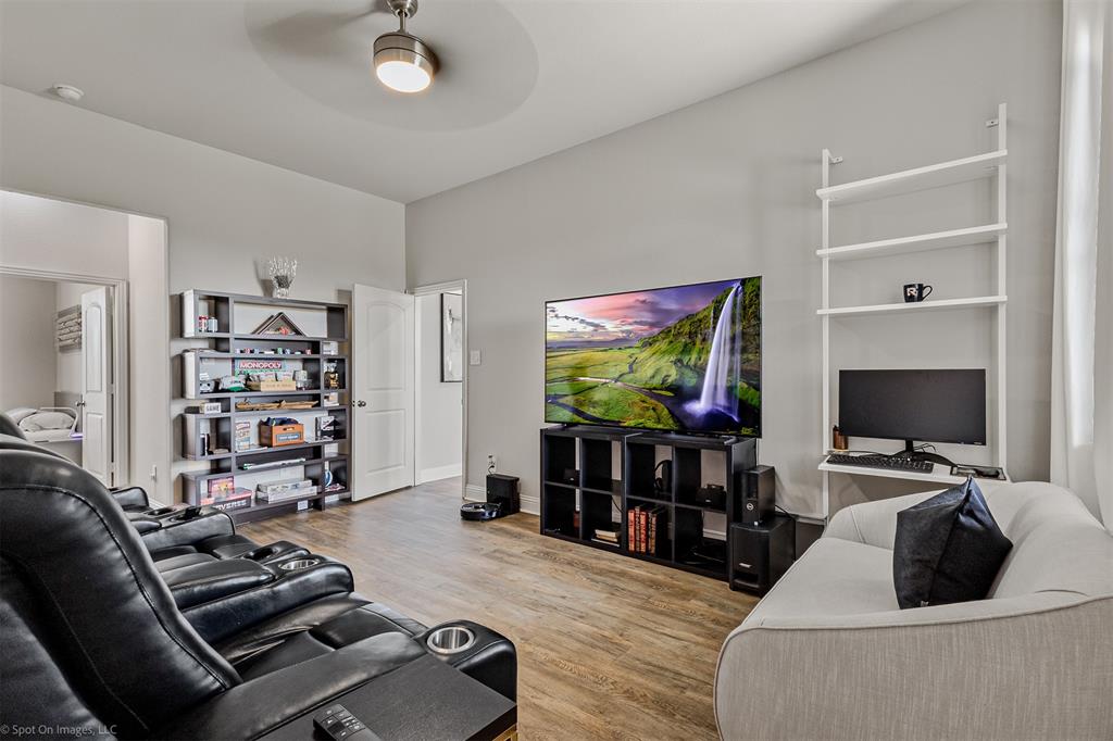 6513 Earley Way Forney, TX 75126 - Photo 22 of 36 a living room with furniture and a flat screen tv