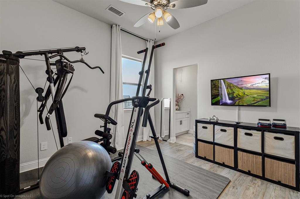 6513 Earley Way Forney, TX 75126 - Photo 23 of 36 a living room with furniture and a flat screen tv