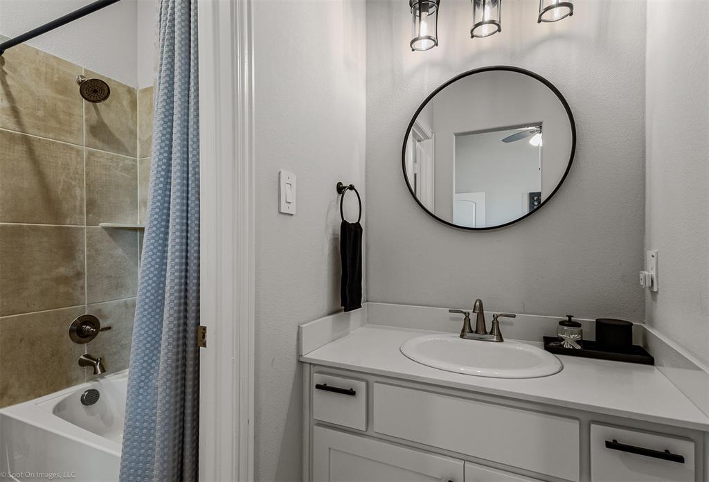 6513 Earley Way Forney, TX 75126 - Photo 26 of 36 a bathroom with a sink and a mirror