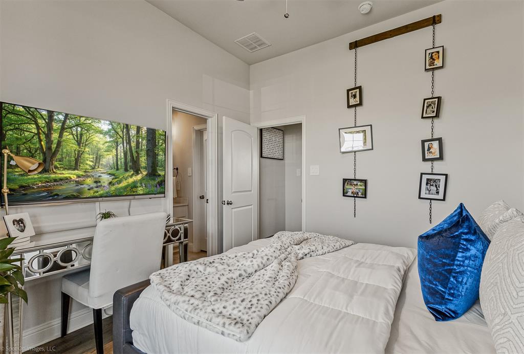 6513 Earley Way Forney, TX 75126 - Photo 28 of 36 a bedroom with a bed window and a chair