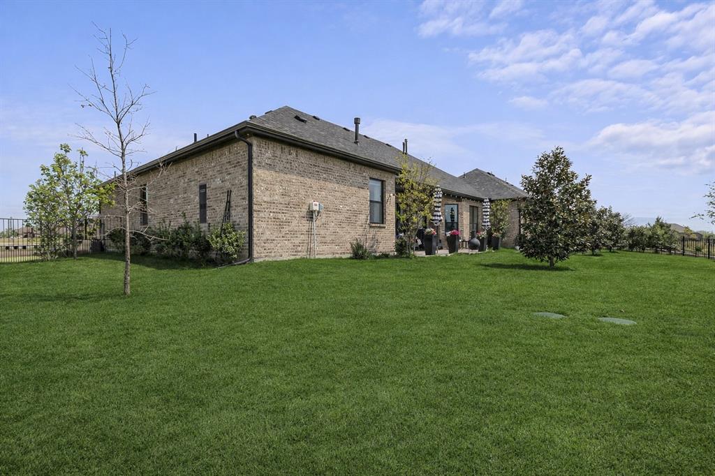6513 Earley Way Forney, TX 75126 - Photo 6 of 36 a view of a backyard of the house