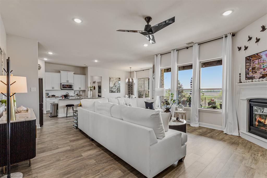 6513 Earley Way Forney, TX 75126 - Photo 9 of 36 a living room with furniture and a fireplace