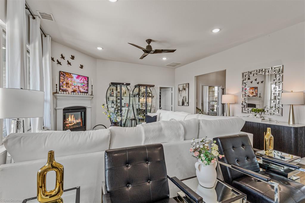 6513 Earley Way Forney, TX 75126 - Photo 10 of 36 a living room with furniture and a fireplace