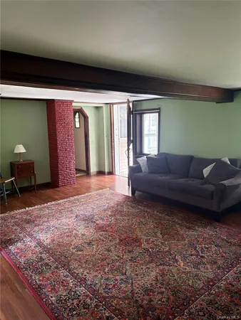 a view of a room with gym equipment and a fireplace