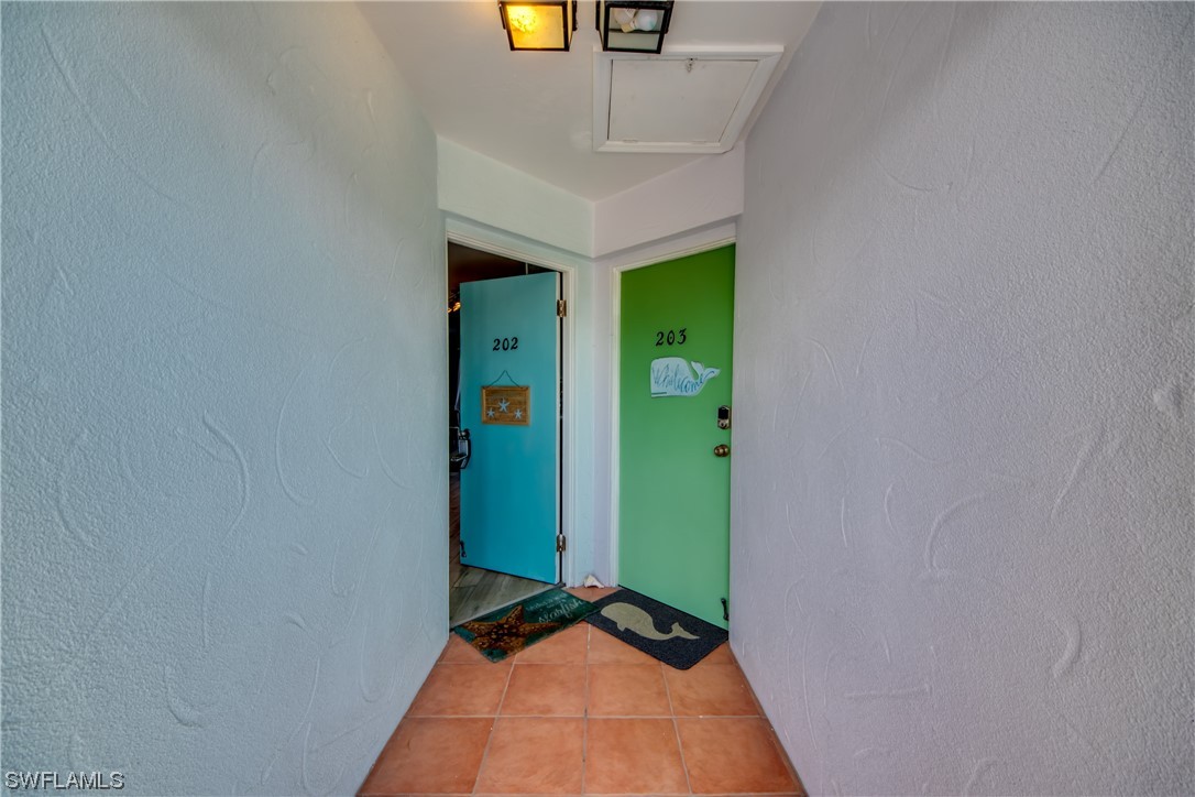 3215 Stringfellow Road, Unit 2D St. James City, FL 33956 - Photo 2 of 39 a view of entryway with a front door