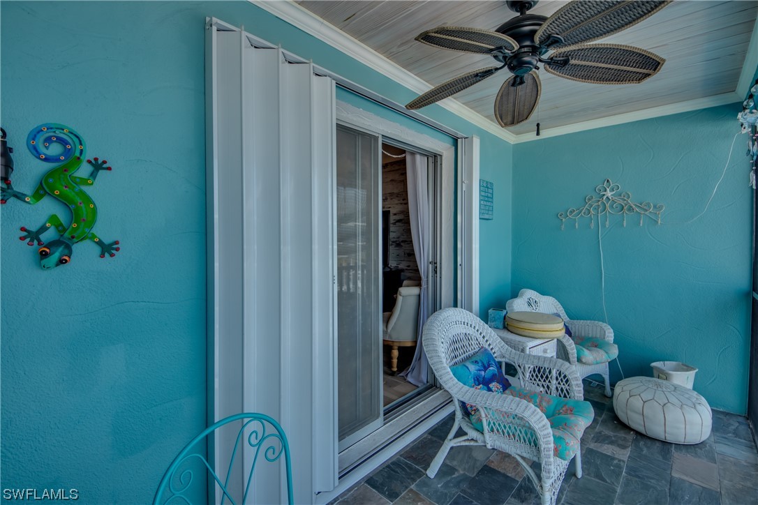 3215 Stringfellow Road, Unit 2D St. James City, FL 33956 - Photo 25 of 39 a dining room with furniture and a potted plant