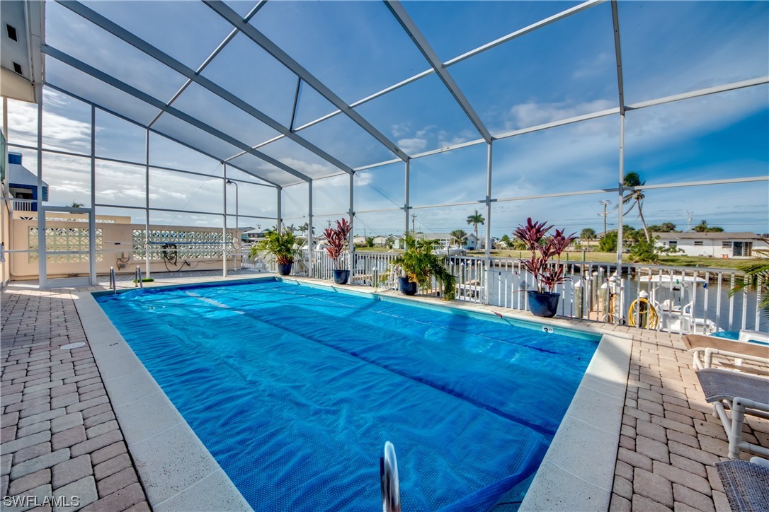 3215 Stringfellow Road, Unit 2D St. James City, FL 33956 - Photo 27 of 39 a view of a swimming pool with sitting space