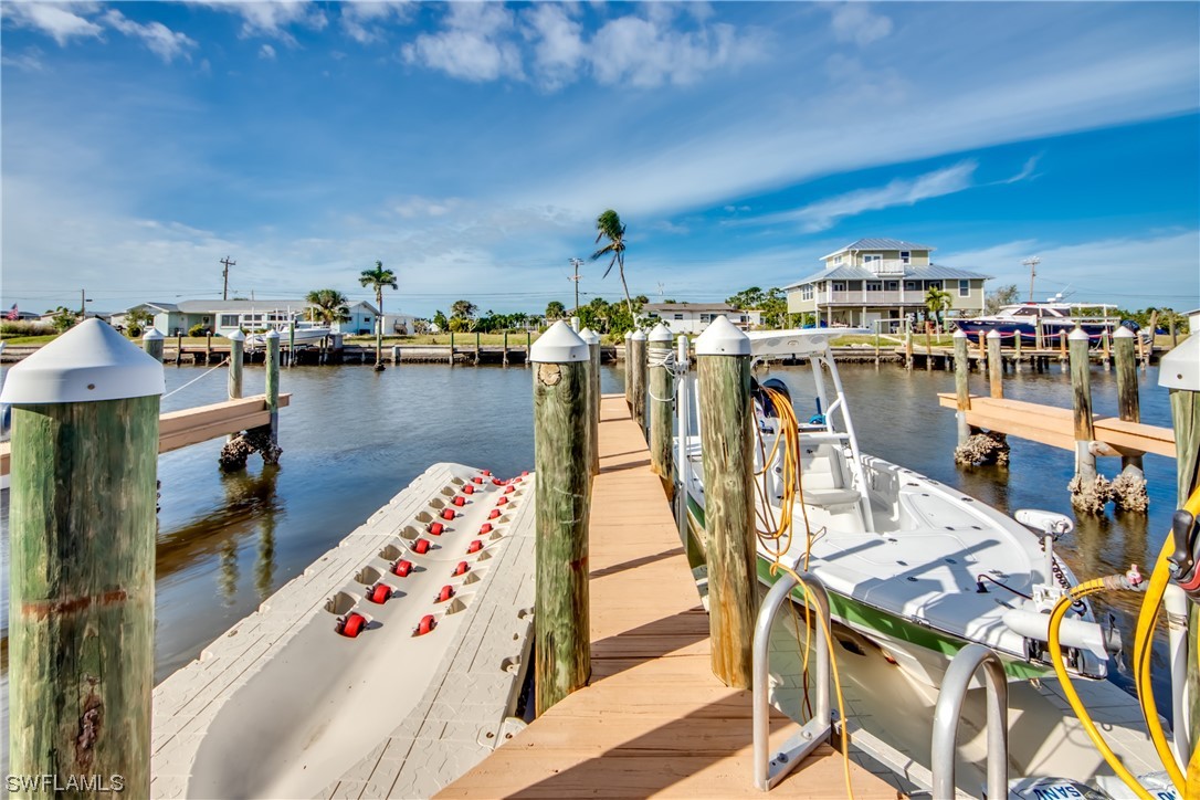 3215 Stringfellow Road, Unit 2D St. James City, FL 33956 - Photo 35 of 39 a view of a lake with sitting area