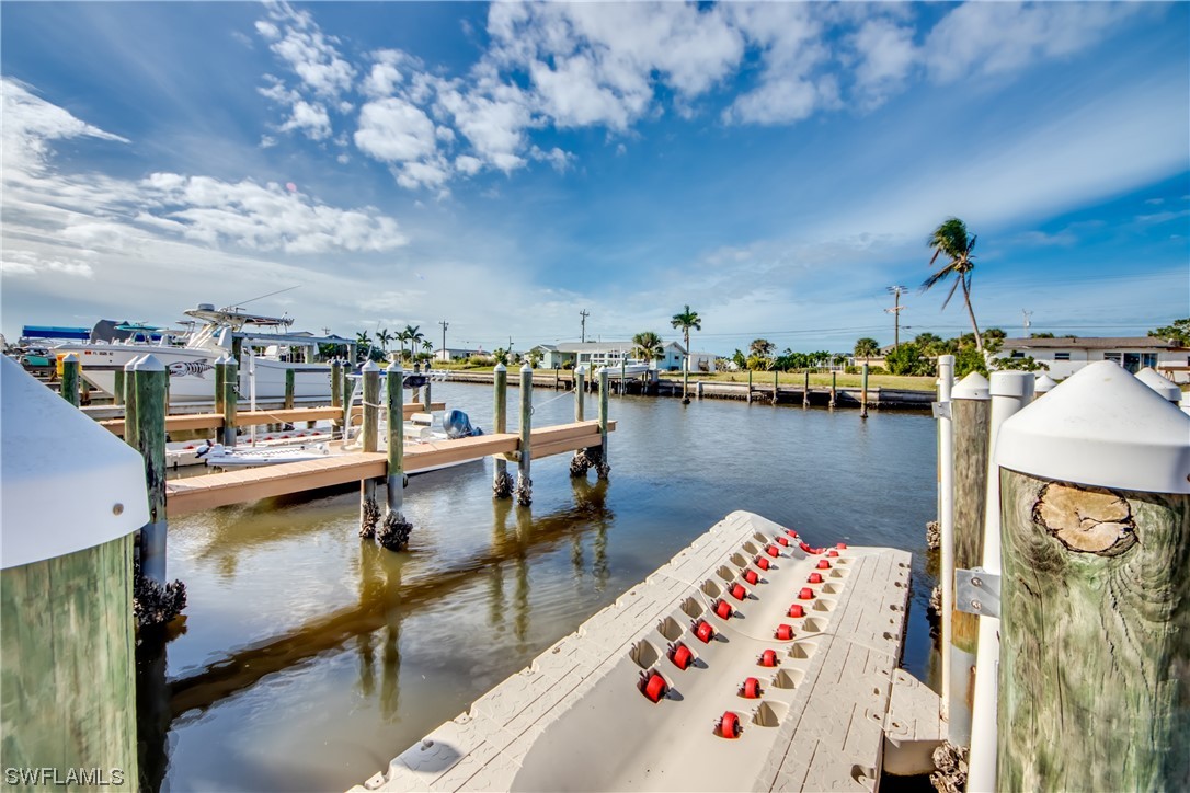 3215 Stringfellow Road, Unit 2D St. James City, FL 33956 - Photo 36 of 39 a view of a lake with sitting area