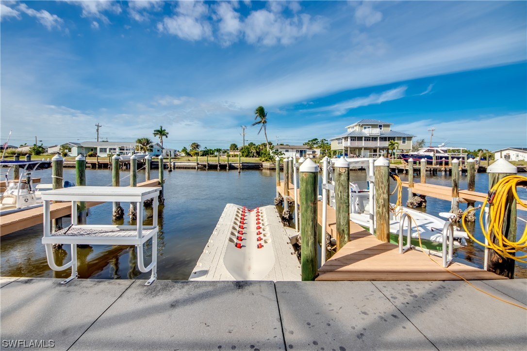 3215 Stringfellow Road, Unit 2D St. James City, FL 33956 - Photo 37 of 39 a view of a chairs and table on the terrace