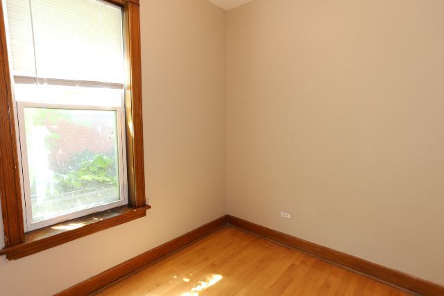 2312 West Iowa Street, Unit 1R Chicago, IL 60622 - Photo 16 of 20 an empty room with a window