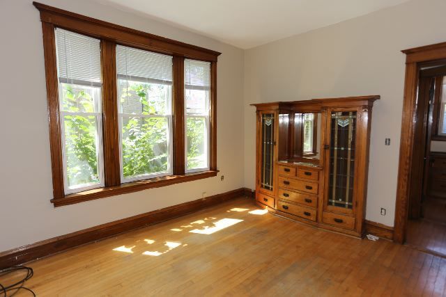 2312 West Iowa Street, Unit 1R Chicago, IL 60622 - Photo 5 of 20 a view of an empty room with window and a livingroom