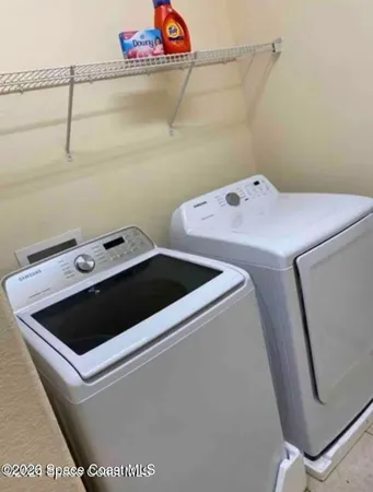 a utility room with dryer and washer