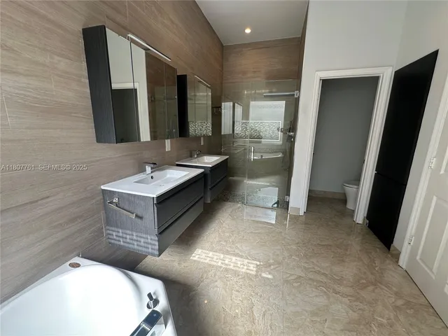 a living room with fireplace furniture and a chandelier